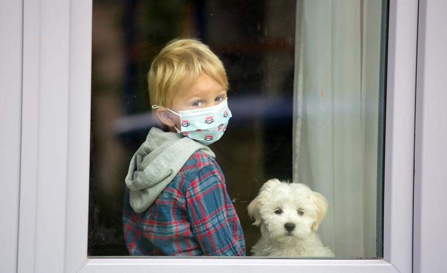 Kid with mask with his dog