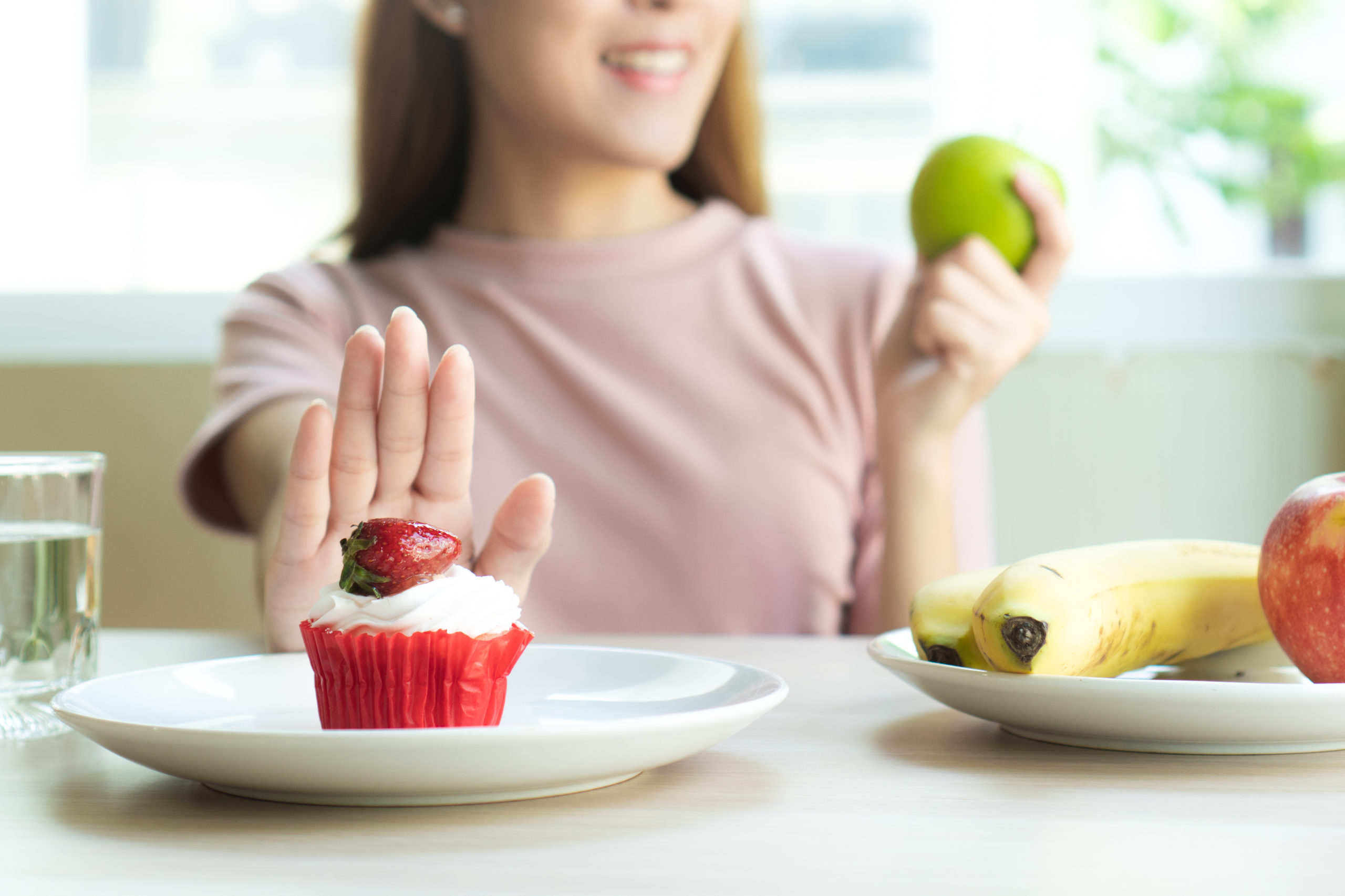 Woman refusing to eat sweet